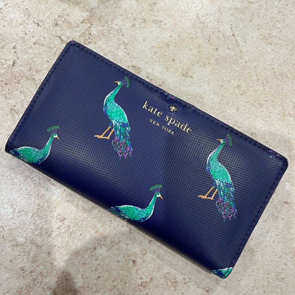 Kate Spade purple peacock wallet. Used but basically brand new, worn 2-3 times.
